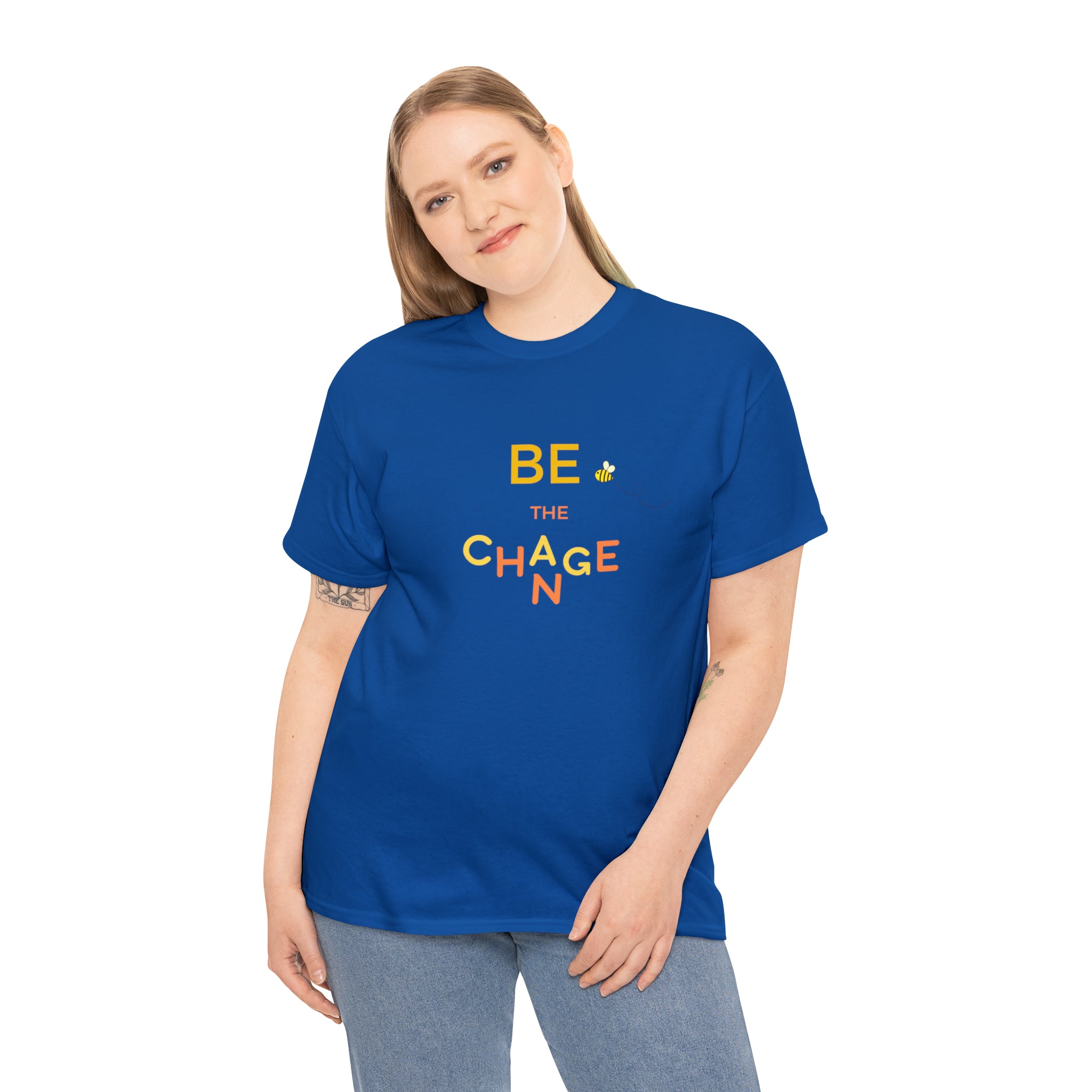 Adult Women wearing teal blue T-Shirt with "Be The Change" motivational image on front.