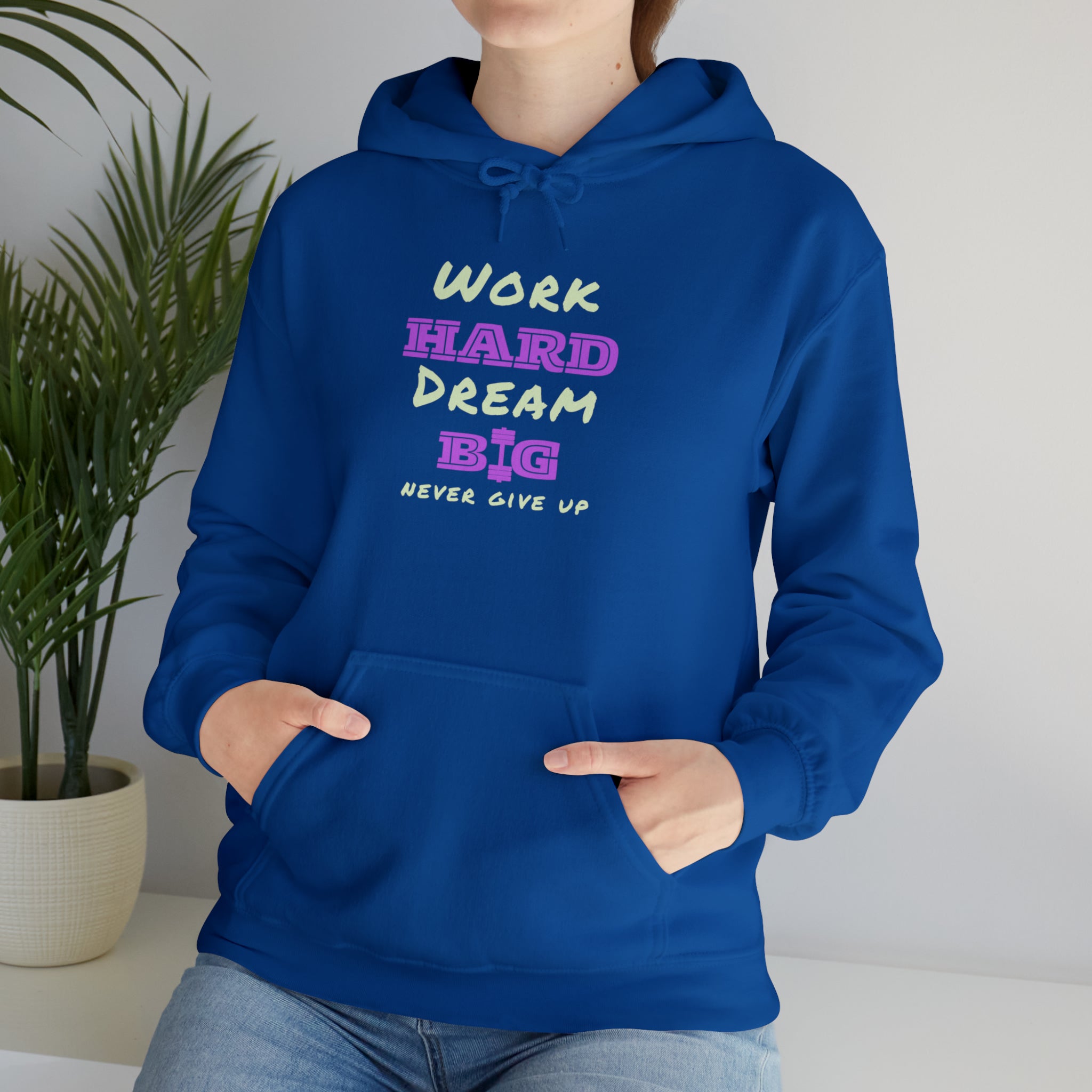 Adult Model wearing Royal Hoodie with Work Hard Dream Big Never Give Up Image on front.