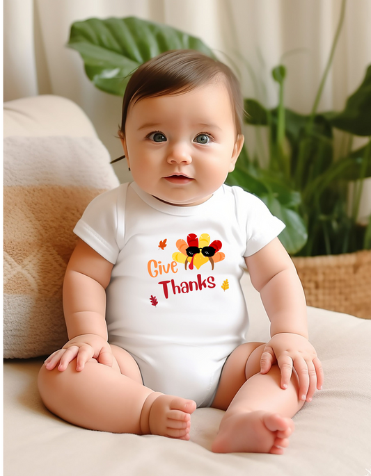 Infant white onesie " Give Thanks" with Turkey head on front.