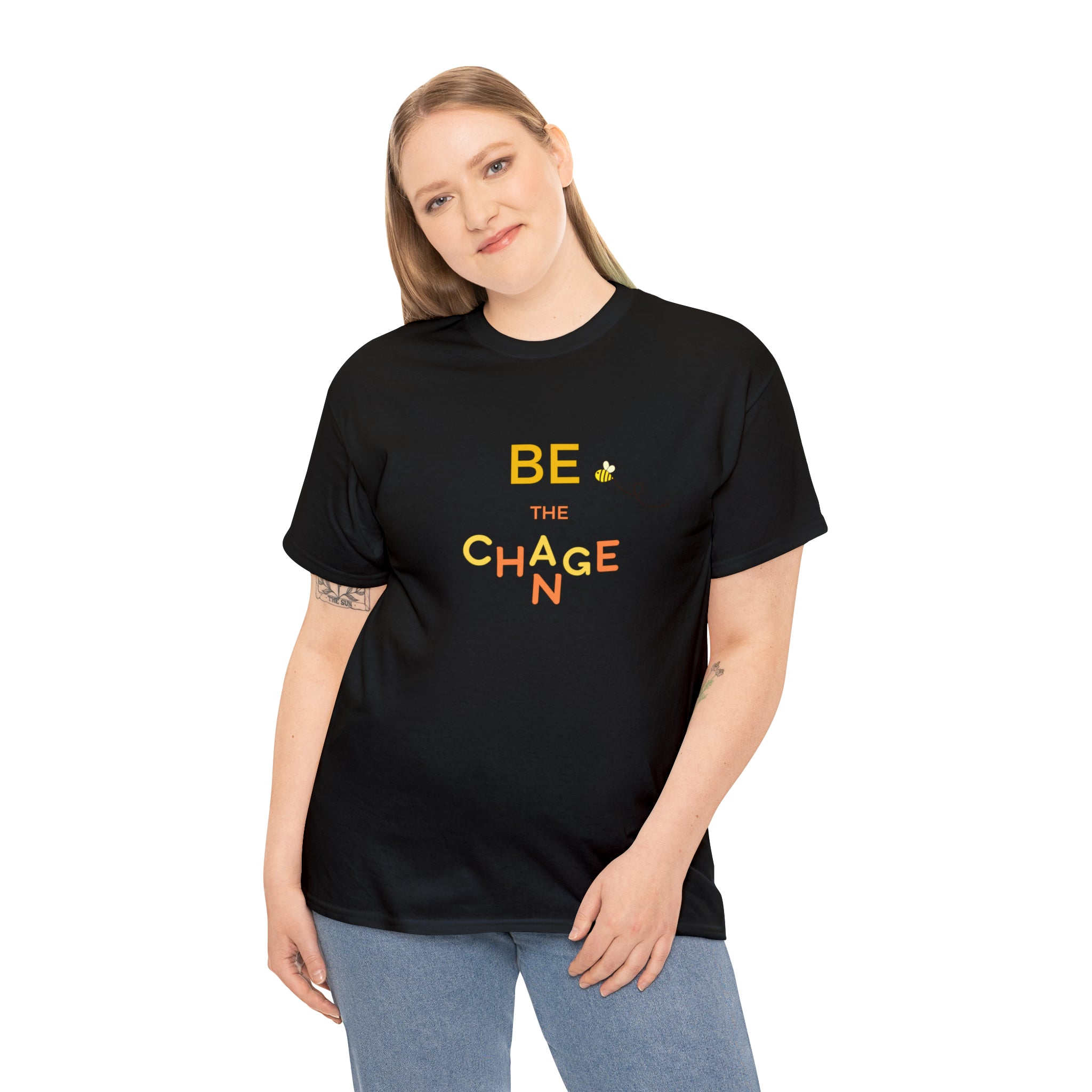 Adult Women wearing black T-Shirt with "Be The Change" motivational image on front.