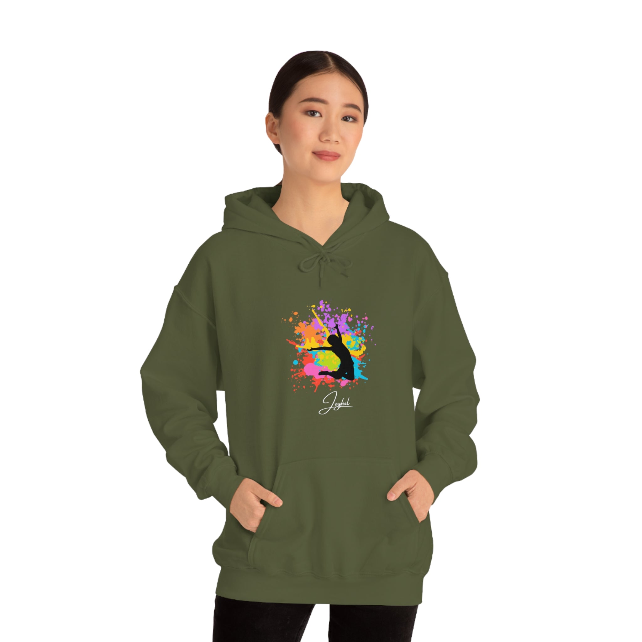 Adult female wearing military green sweatshirt with "Joyful" image on front