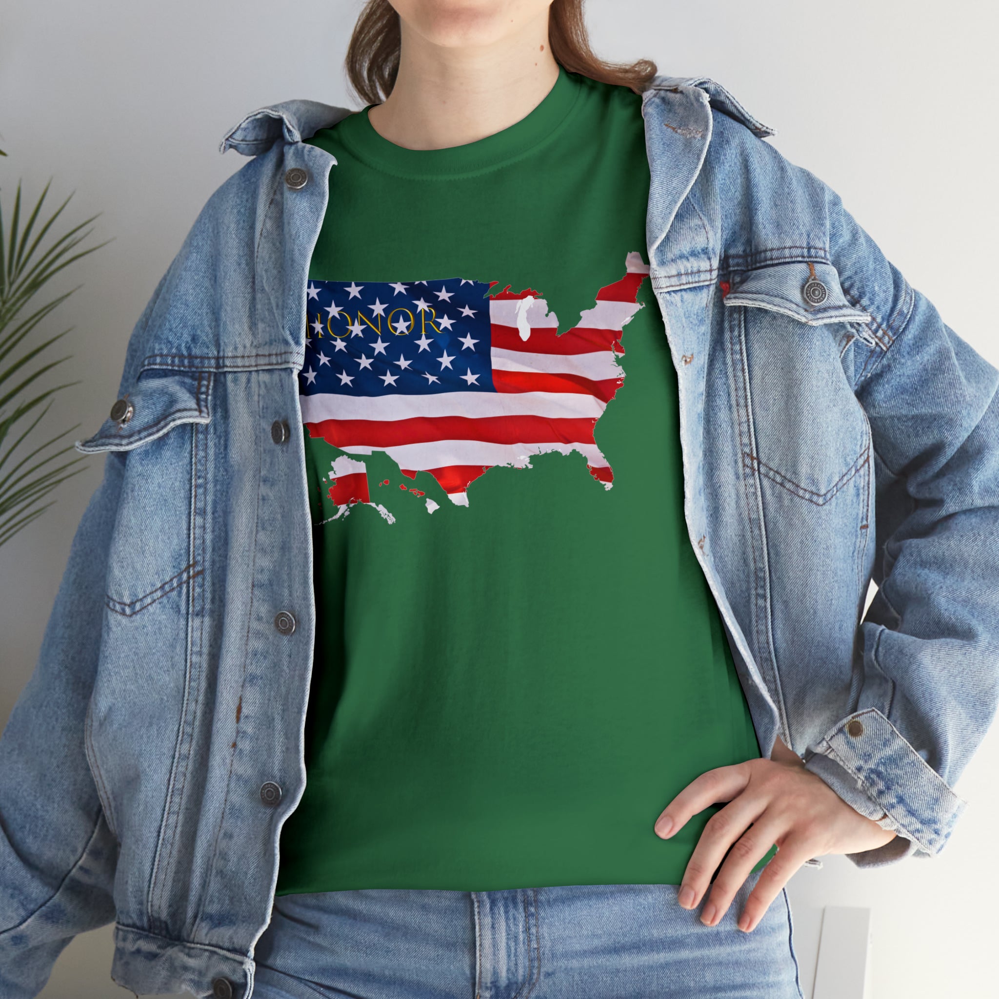 Adult female wearing irish green T-Shirt with "Honor USA" inspired American as a Flag graphic on front, with jean jacket