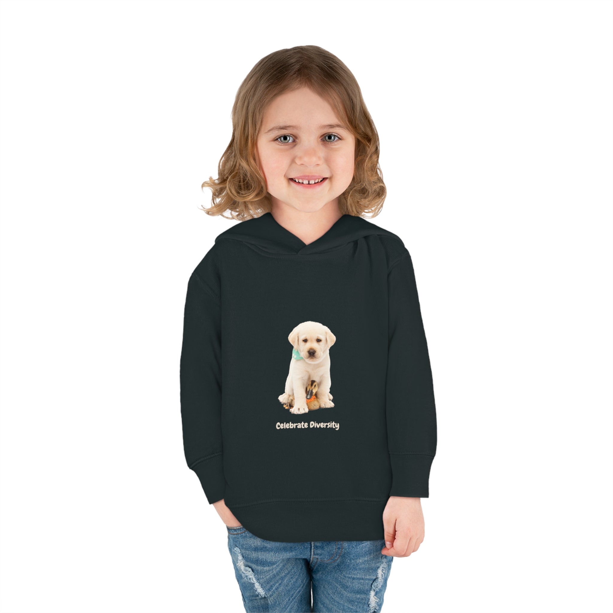 Toddler girl wearing black unisex hoodie with "Celebrate Diversity" inspired graphic with puppy and duck on front.