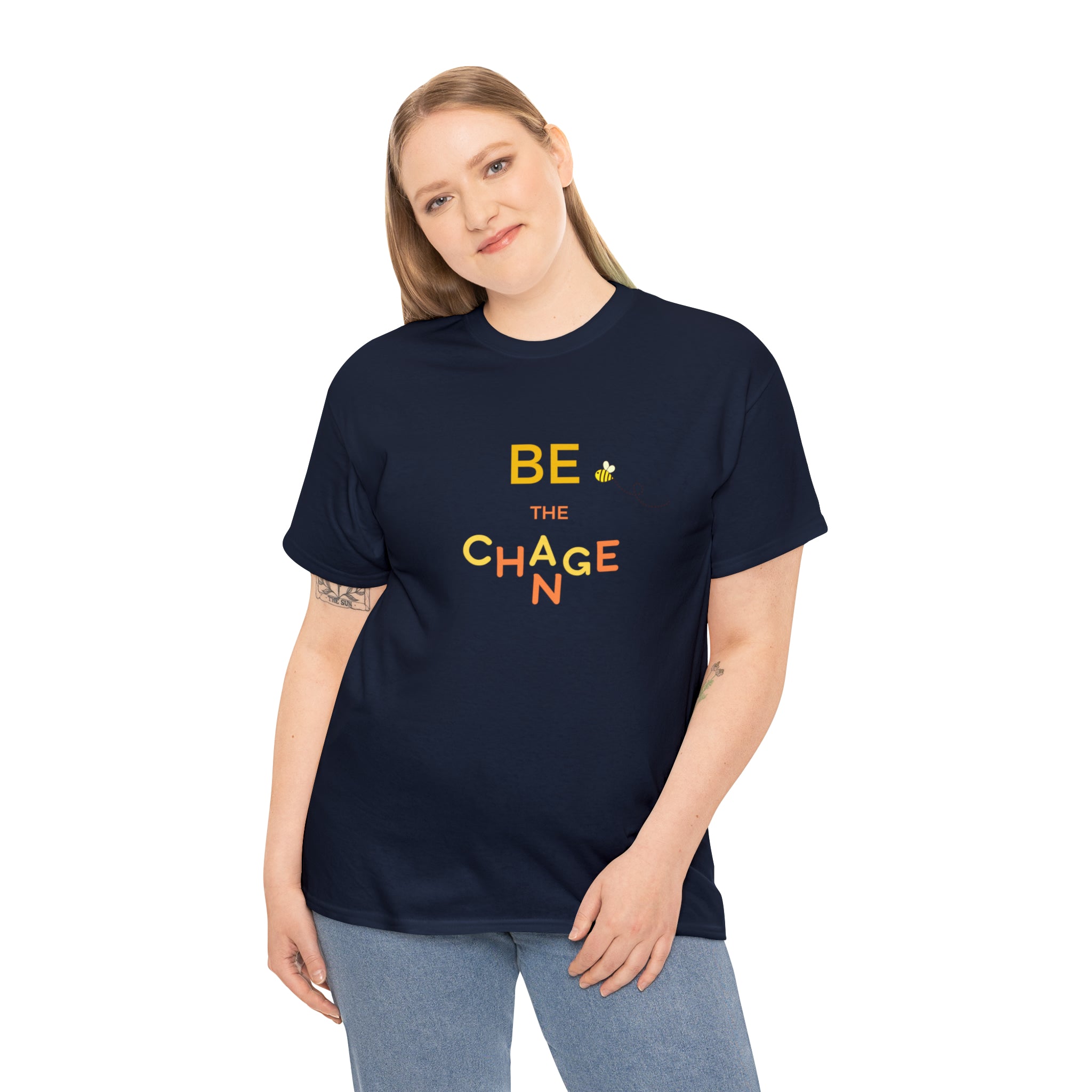 Adult Women wearing navy T-Shirt with "Be The Change" motivational image on front.