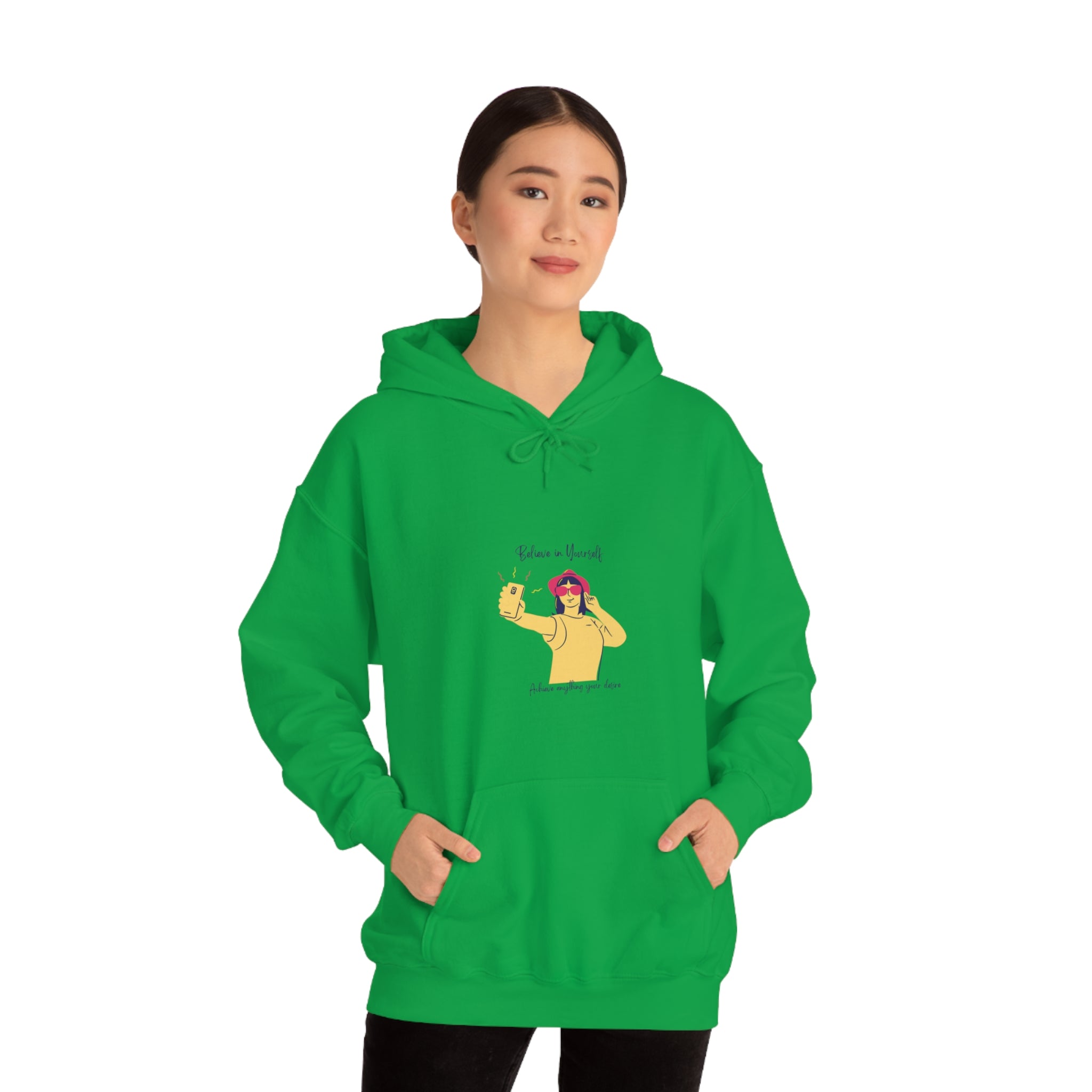 Adult female wearing irish green hoodie with "Believe in yourself, Achieve anything you desire" girl taking picture of herself inspired graphic.