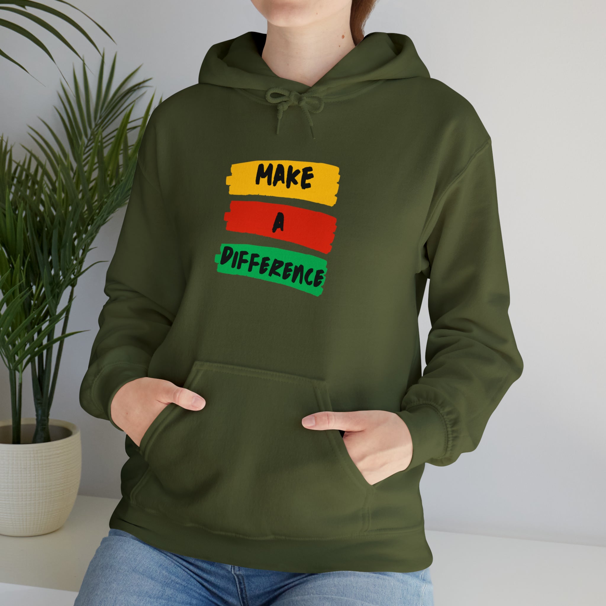 Adult female wearing military green hoodie " Make A Difference" inspired images.