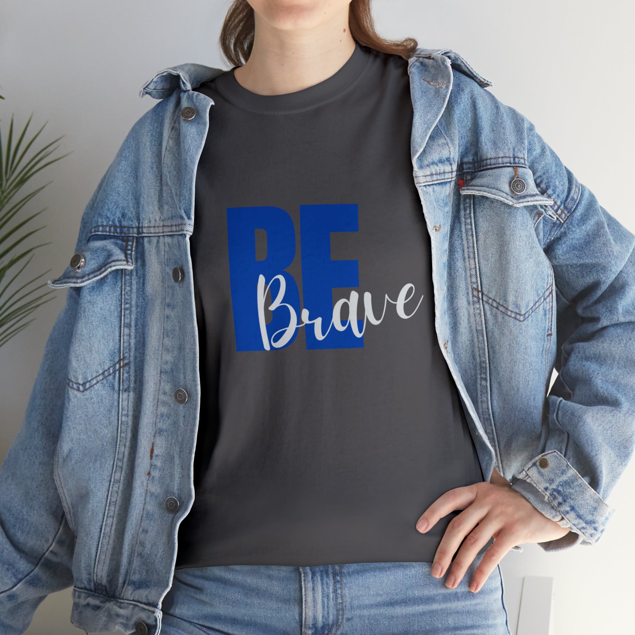 Adult women wearing charcoal T-Shirt and Jean jacket with "Be Brave" motivational image on front.