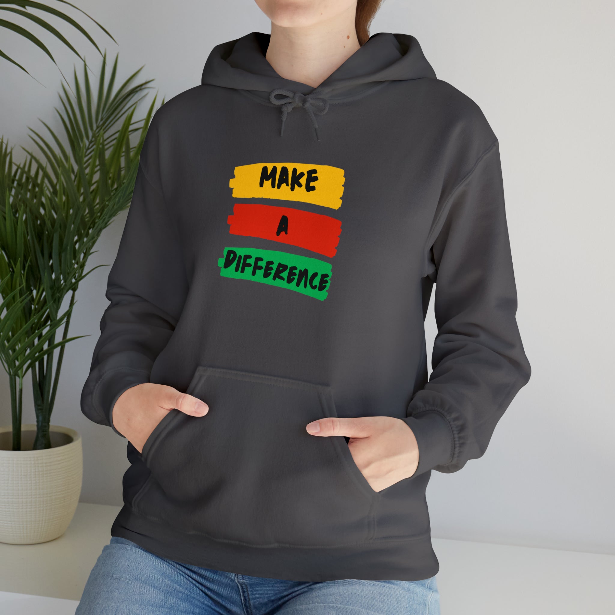 Adult female wearing charcoal hoodie " Make A Difference" inspired images.