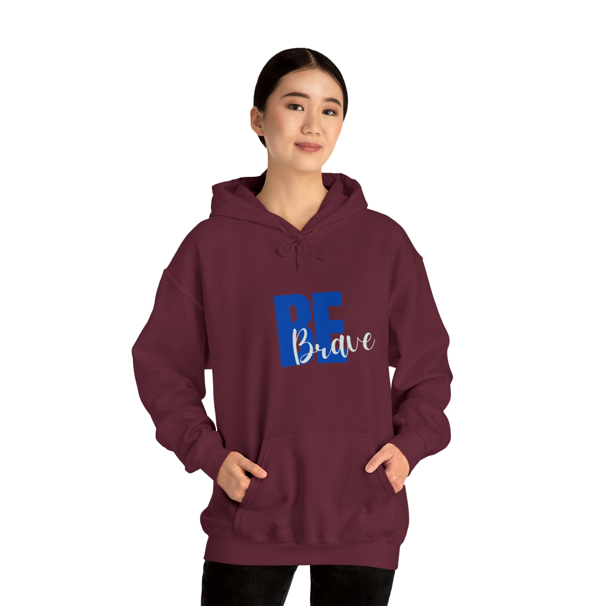 Adult Women wearing maroon hoodie with "Be Brave" motivational image on front.