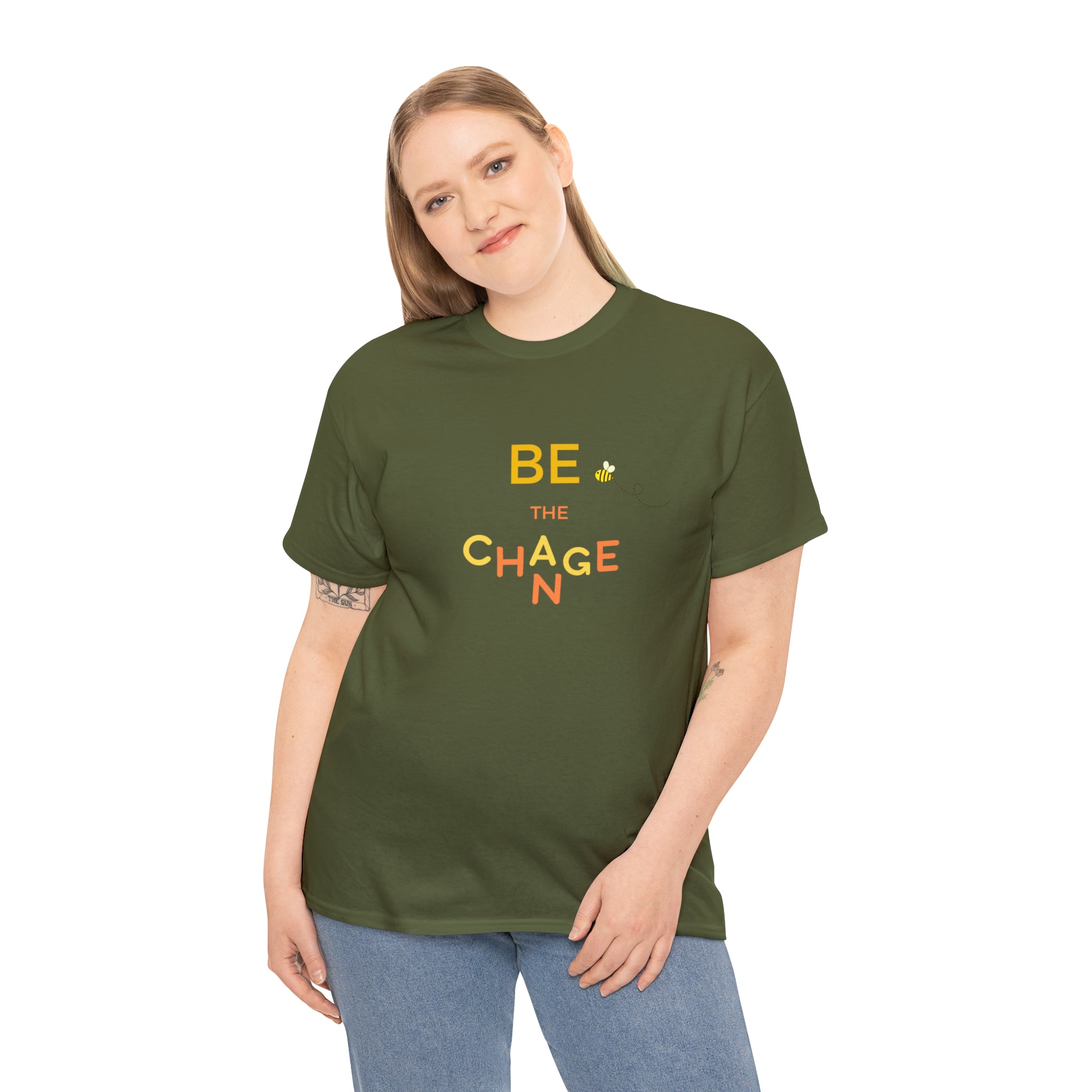 Adult Women wearing army green T-Shirt with "Be The Change" motivational image on front.