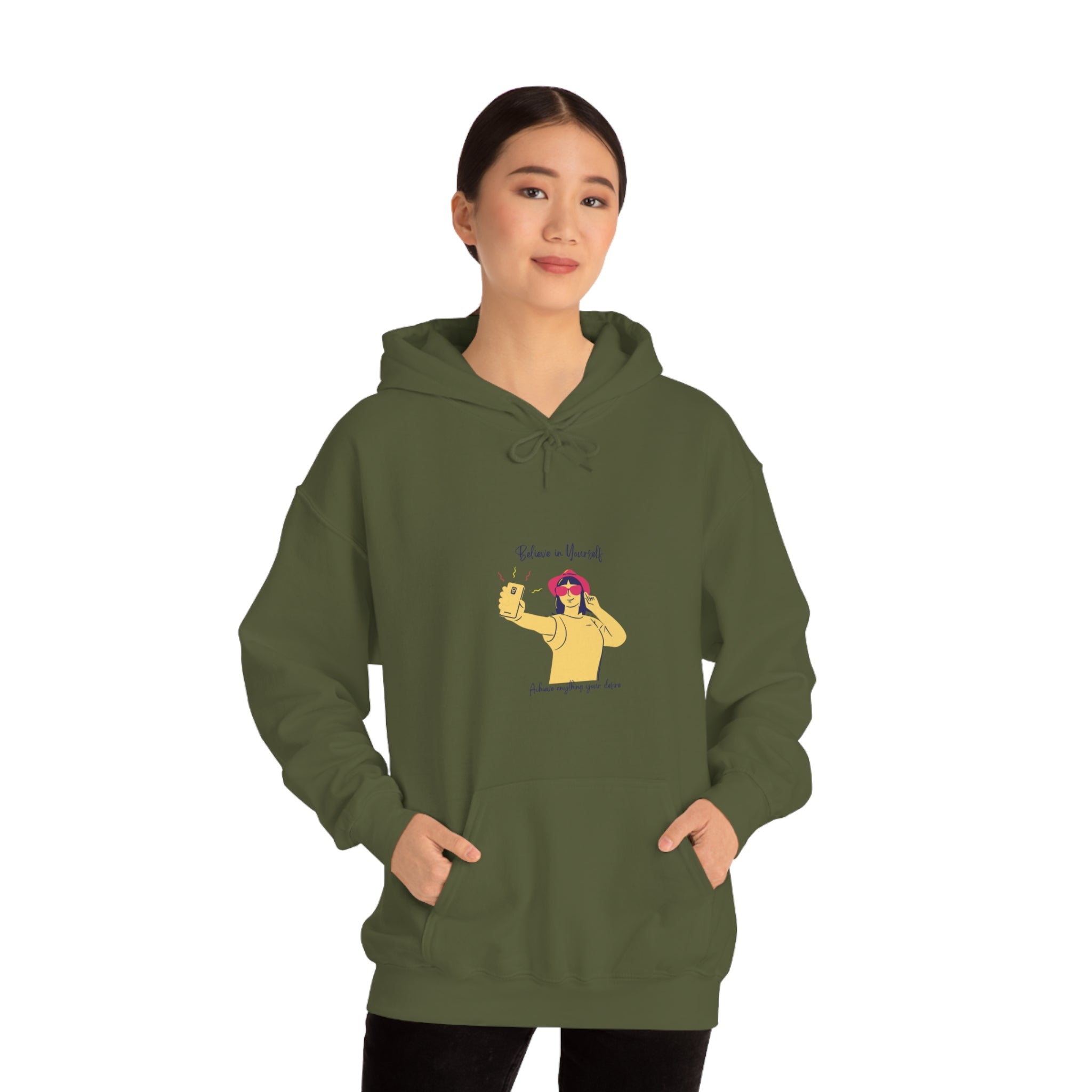Adult female wearing army green hoodie with "Believe in yourself, Achieve anything you desire" girl taking picture of herself inspired graphic.