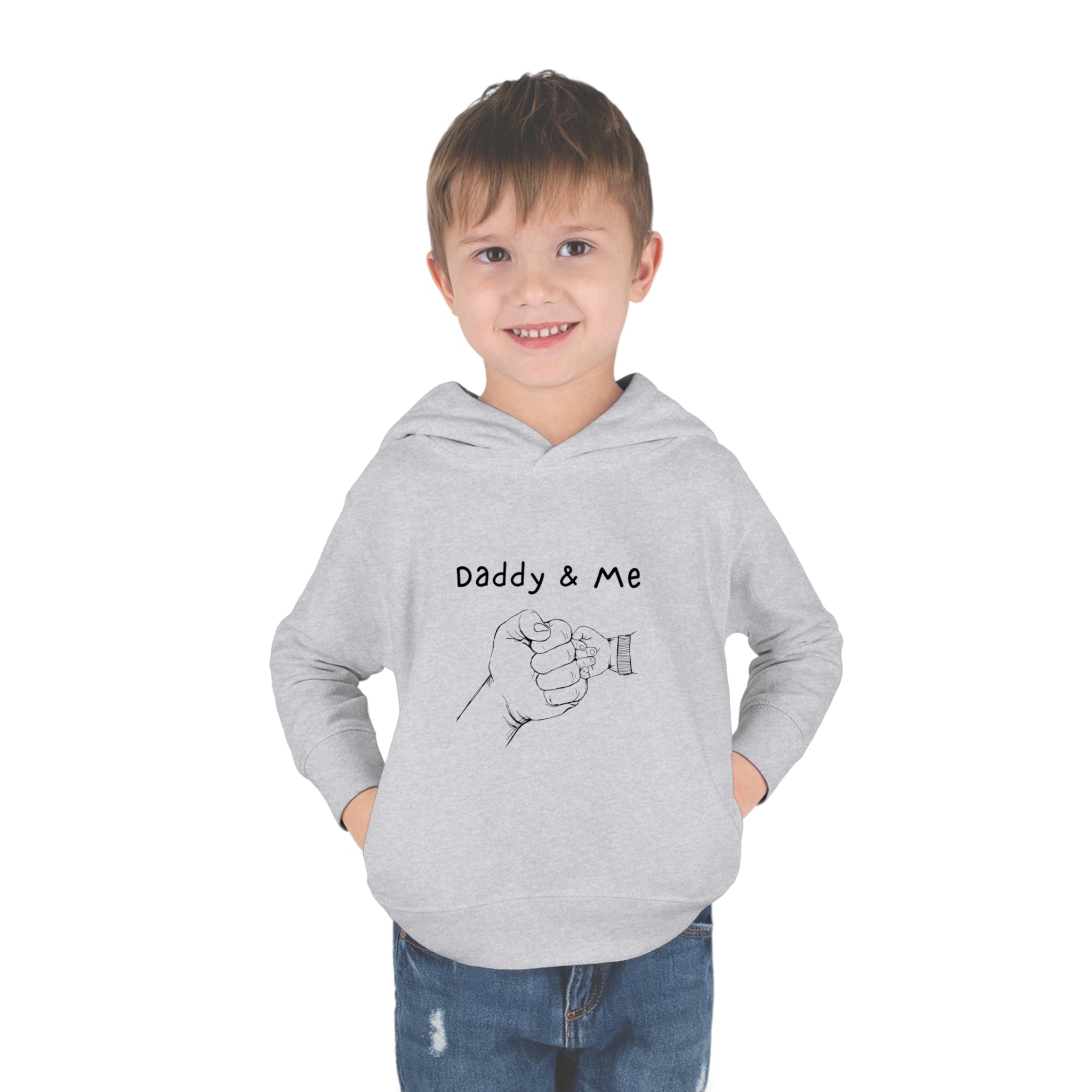 Toddler boy sports grey hoodie " Daddy & Me" with fist bumps hands on front.
