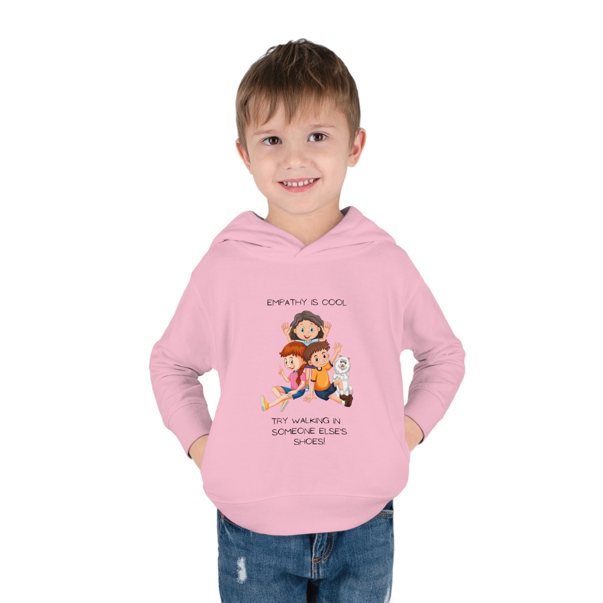 Toddler boy wearing light pink hoodie " Empathy Is Cool Try Walking In Someone Else's Shoes" Inspired message on front.