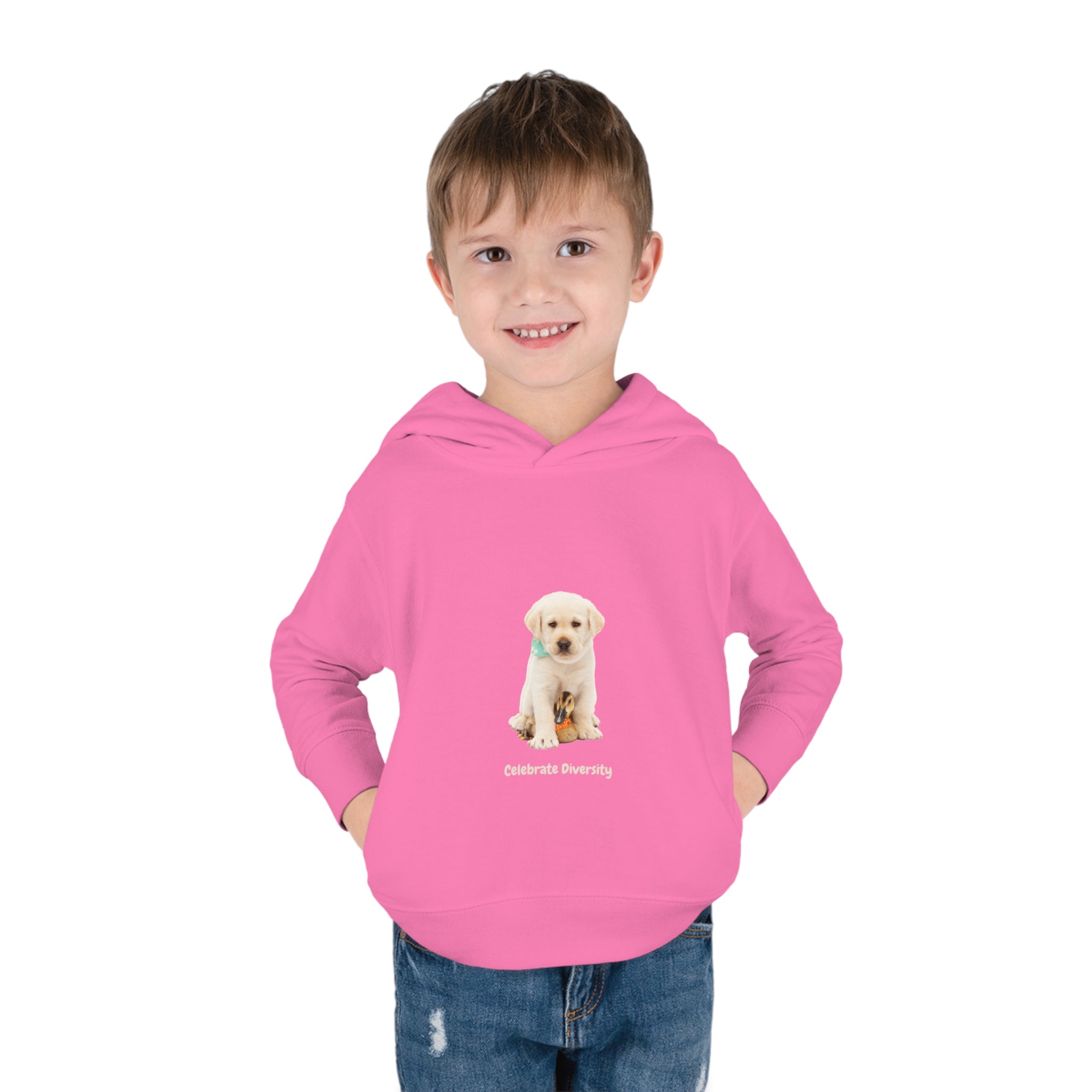 Toddler boy wearing hot pink unisex hoodie with "Celebrate Diversity" inspired graphic with puppy and duck on front.