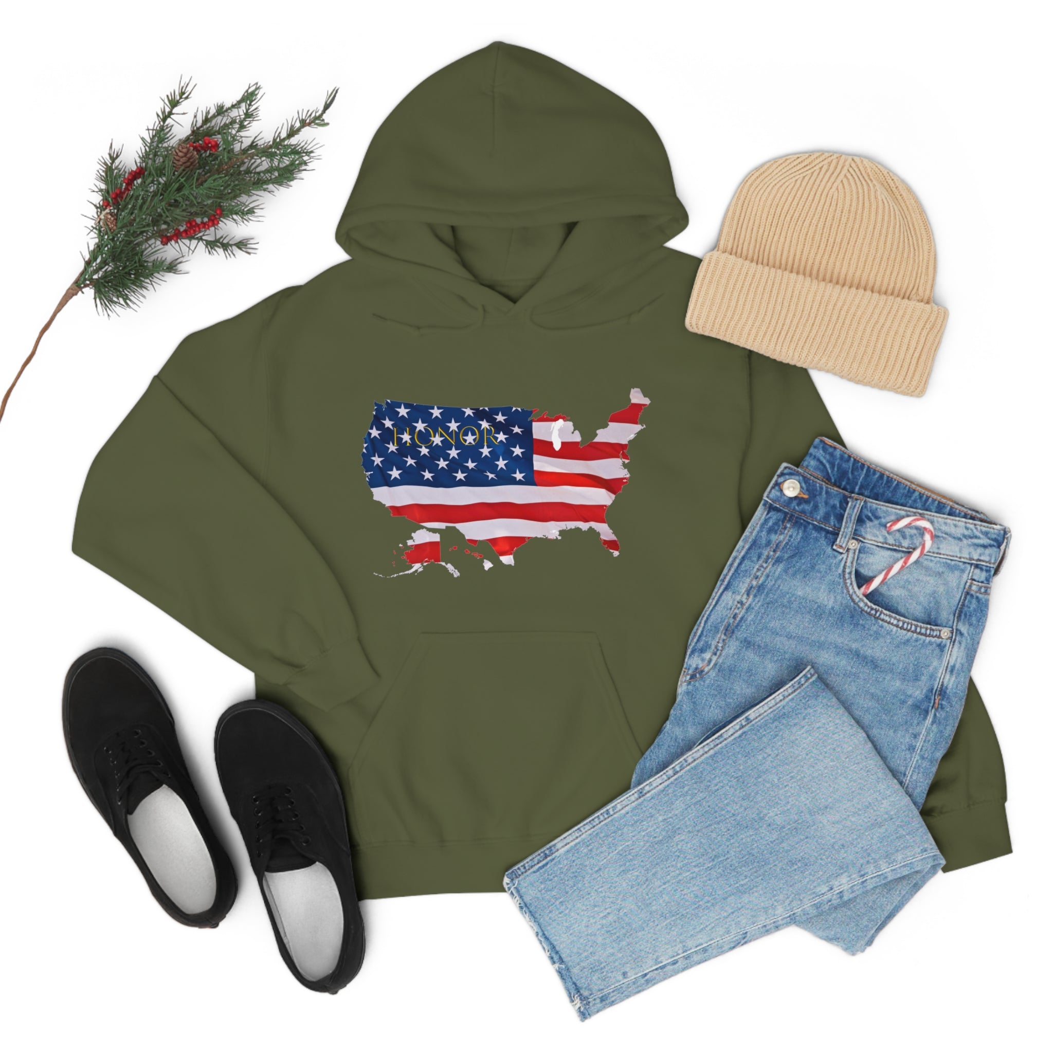 Adult unisex military green hoodie with "Honor USA" inspired American as a Flag graphic on front, tan hat, blue jeans, black sneakers.