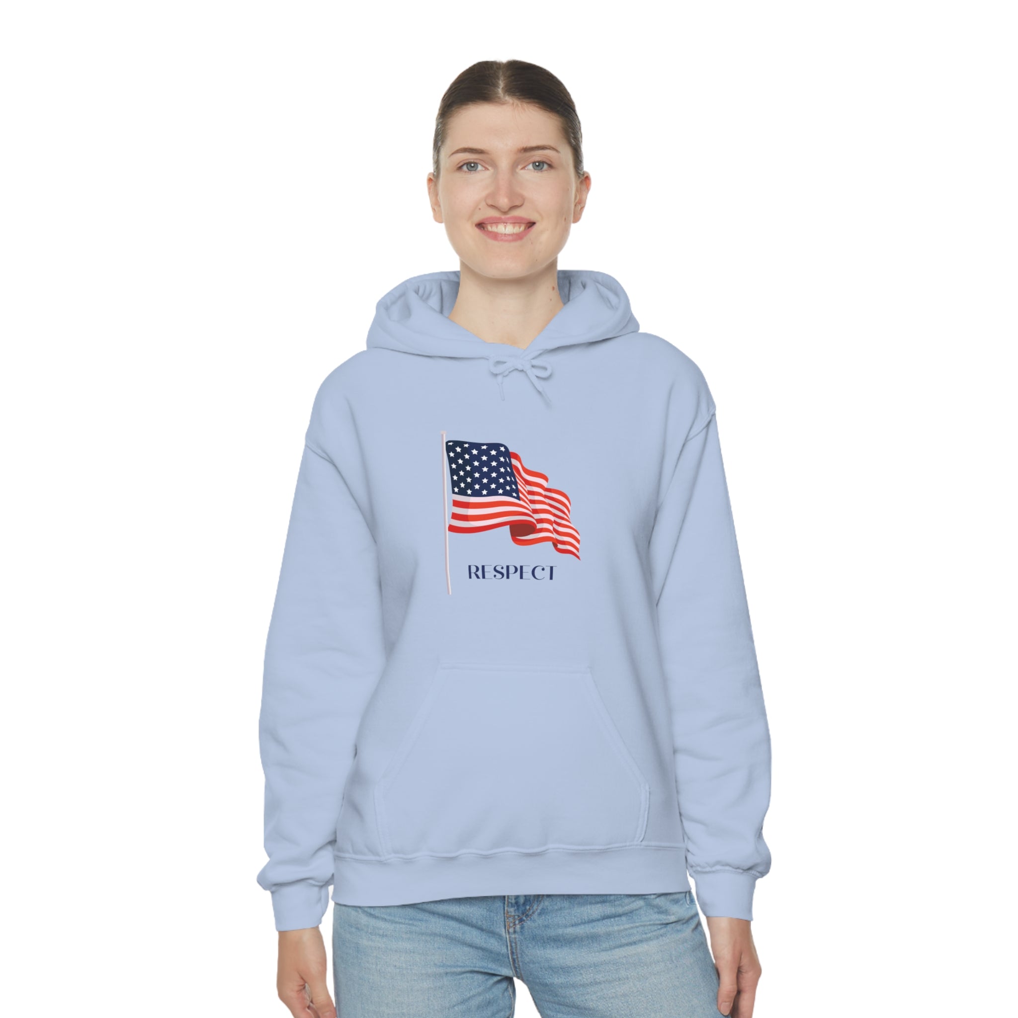 Adult female wearing light blue hoodie with "Respect" inspired American Flag on front.