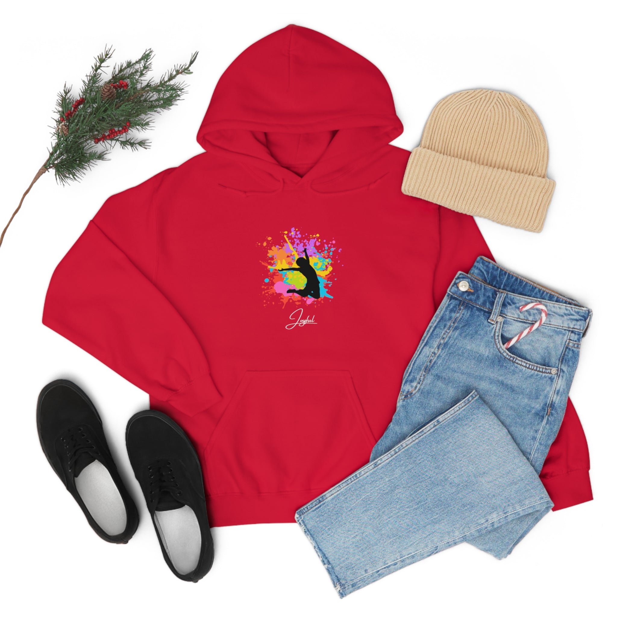 Adult outfit display with red hoodie with "Joyful " graphic on front, black shoes, blue jeans, tan hat .
