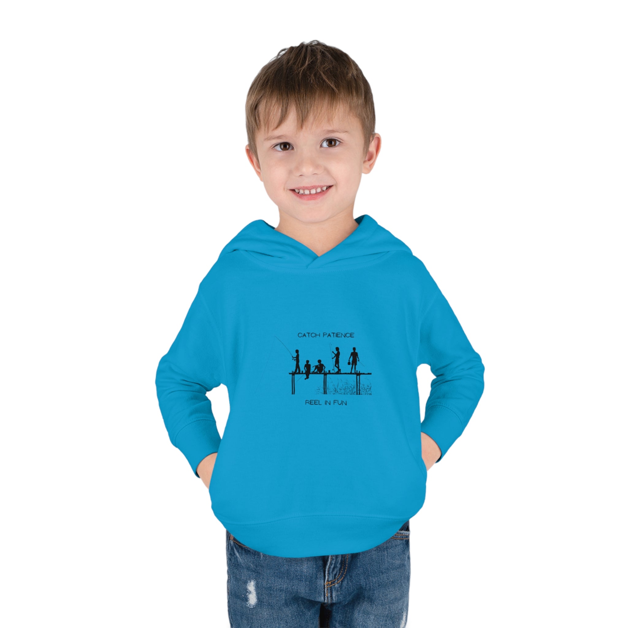 Boy Toddler unisex wearing Royal blue hoodie with "Catch Patience Reel in Fun" inspired graphic of people fishing.