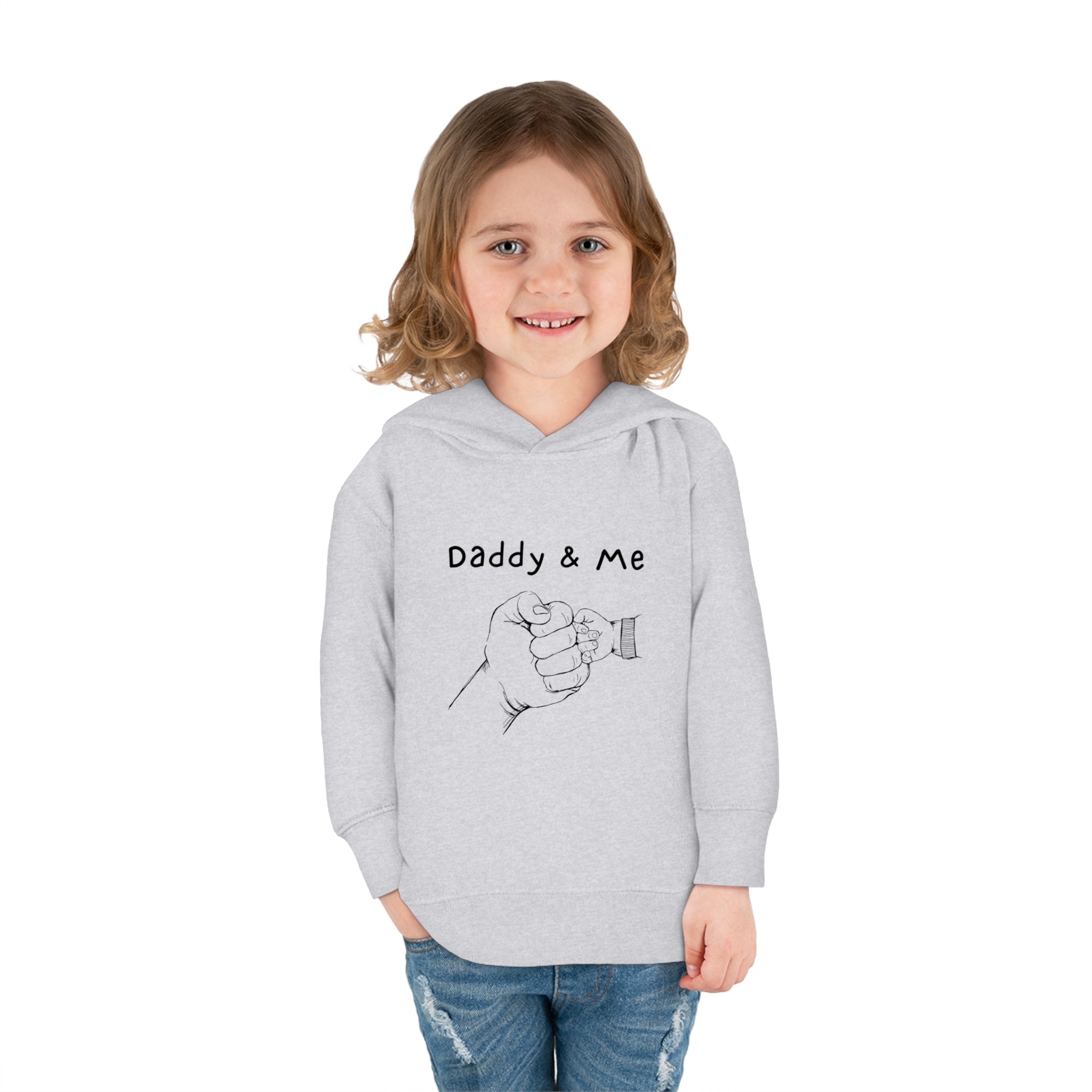 Toddler girl sports grey hoodie " Daddy & Me" with fist bumps hands on front.