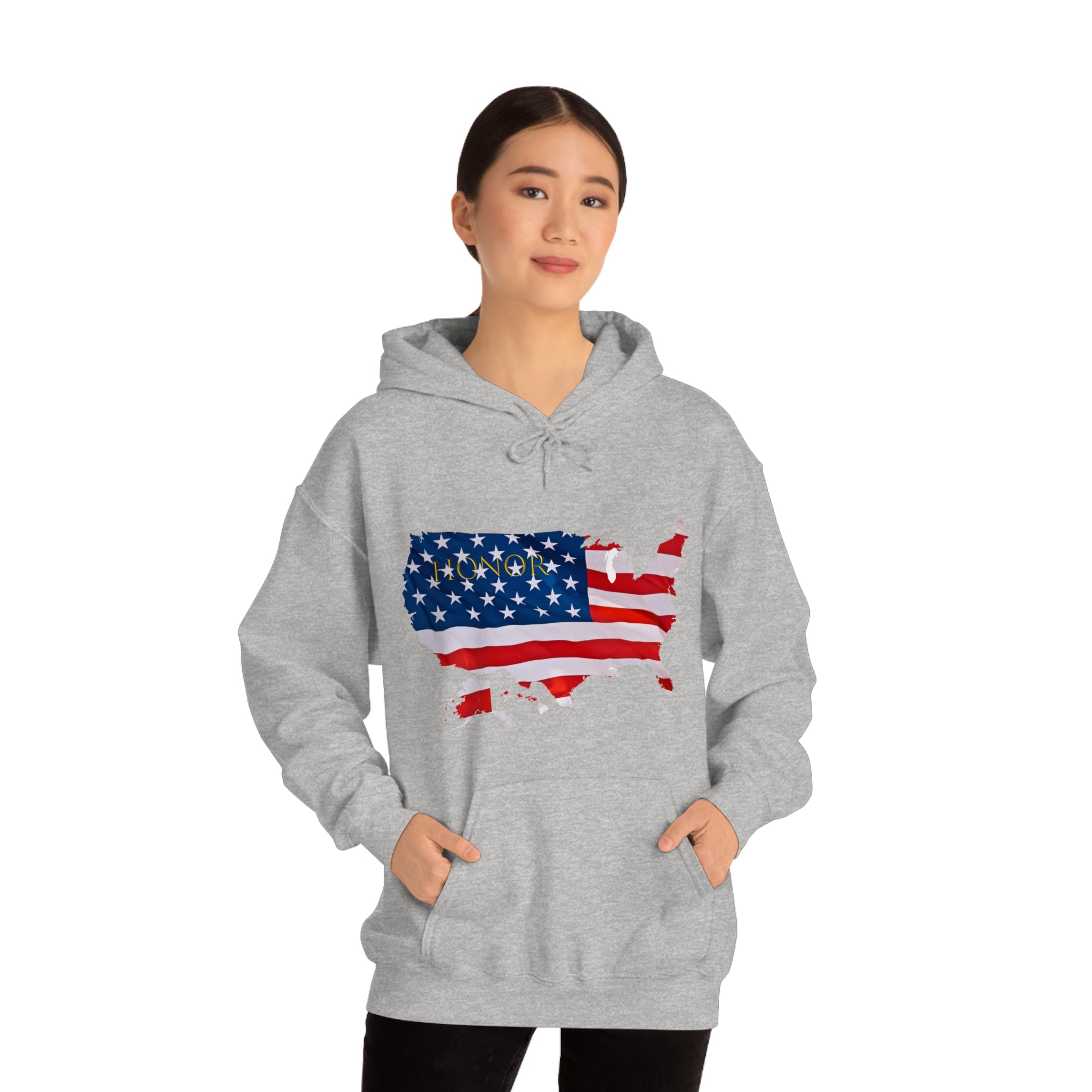 Adult female wearing sports grey hoodie with "Honor USA" inspired American as a Flag graphic on front.