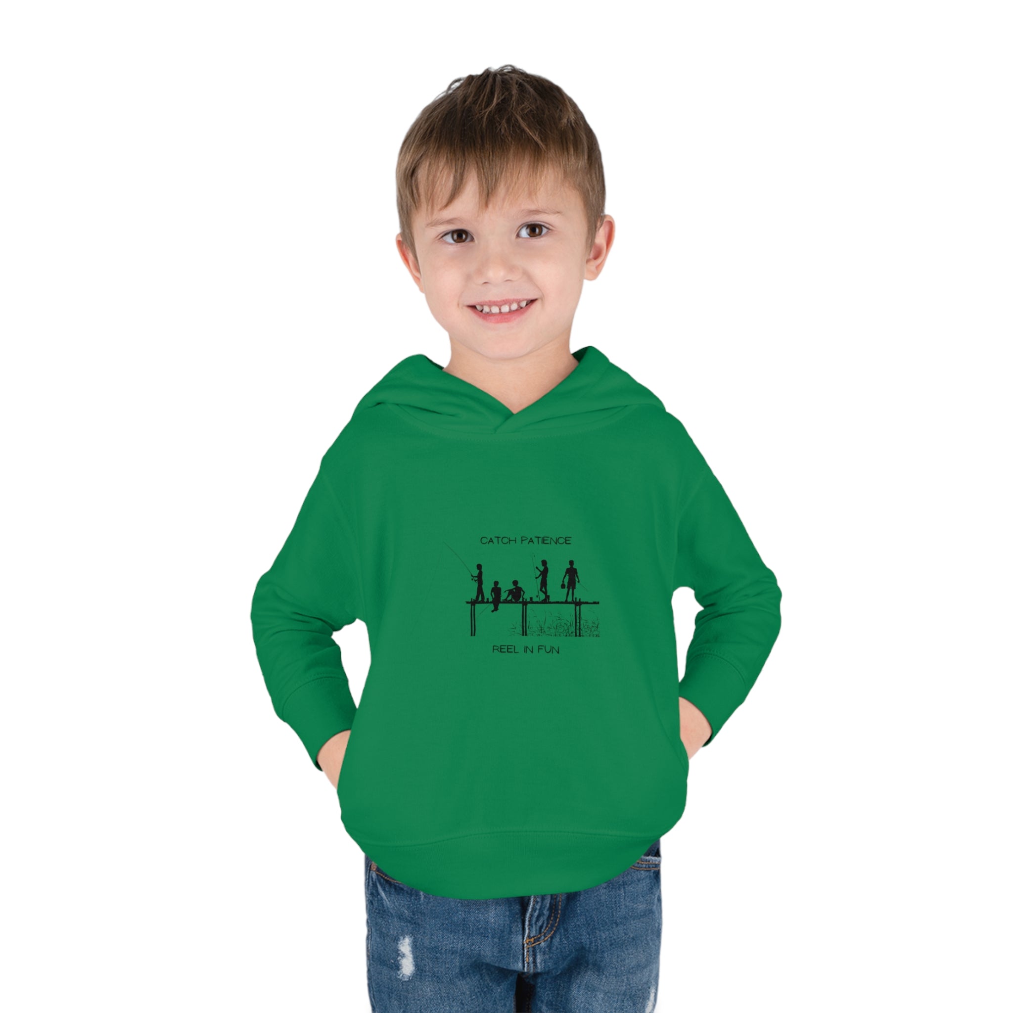 Boy Toddler unisex wearing irish green hoodie with "Catch Patience Reel in Fun" inspired graphic of people fishing.