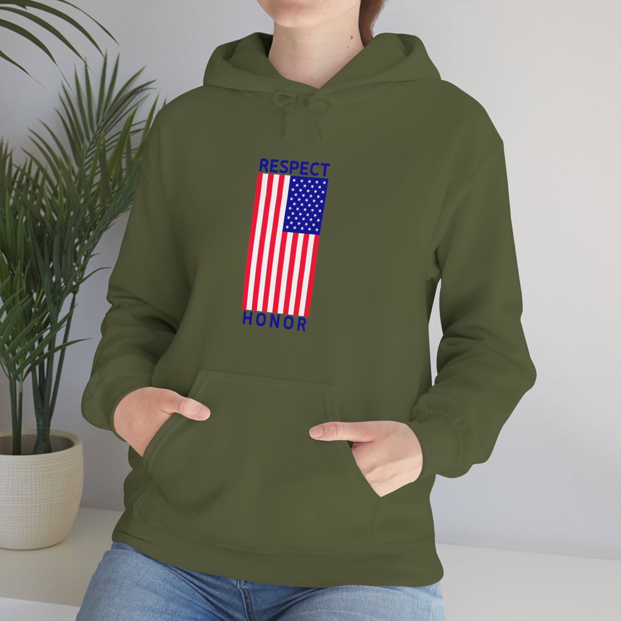 Adult female front view wearing military green hoodie with "Respect Honor" Inspired Classic American Flag on front.