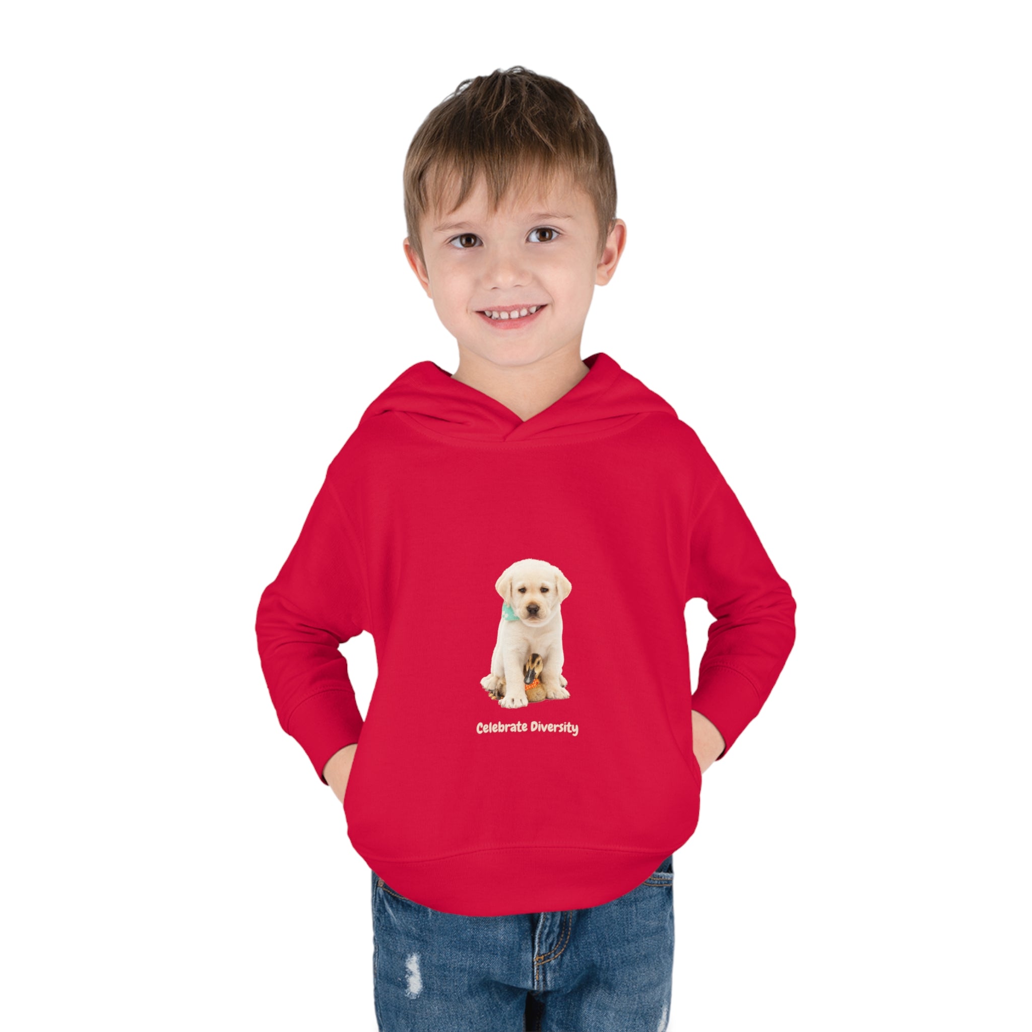 Toddler boy wearing red unisex hoodie with "Celebrate Diversity" inspired graphic with puppy and duck on front.