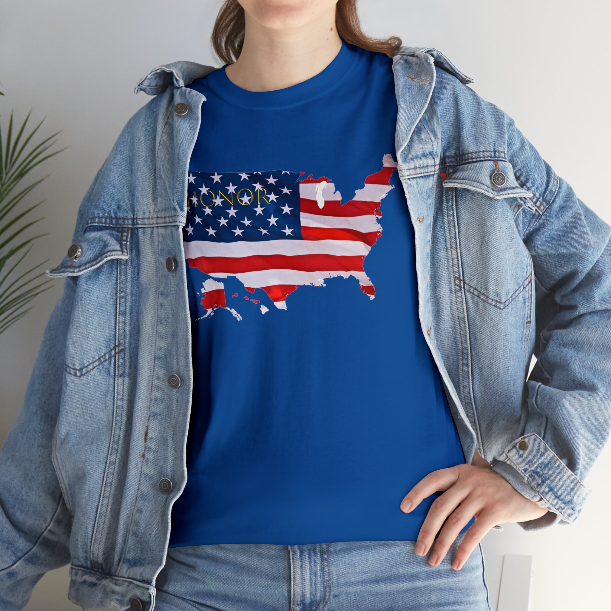 Adult female wearing royal T-Shirt with "Honor USA" inspired American as a Flag graphic on front, with jean jacket