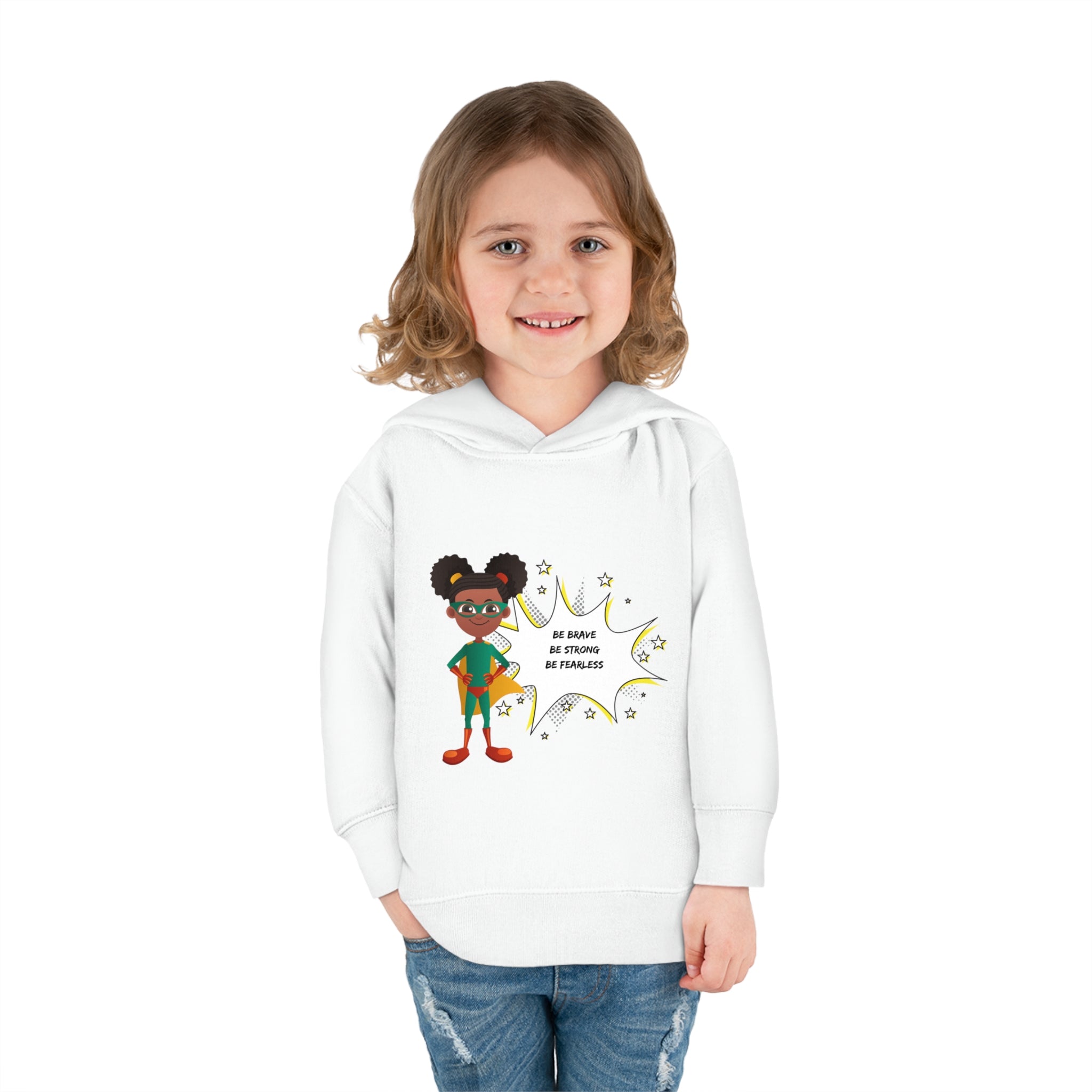 Toddler girl model wearing white hoodie with girl superhero image with Be Bold Be Strong Be Fearless image on front
