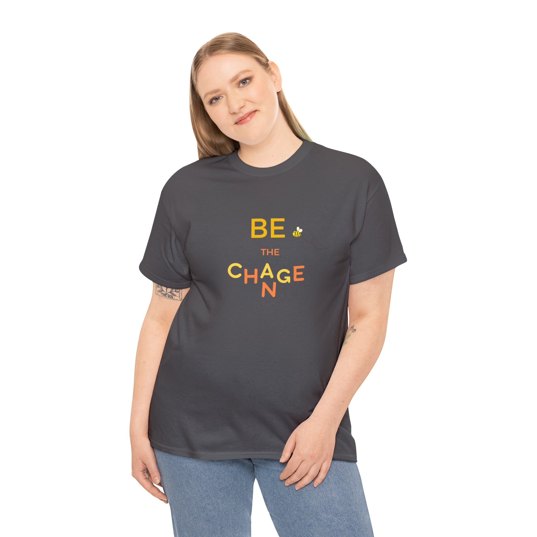 Adult Women wearing charcoal T-Shirt with "Be The Change" motivational image on front.