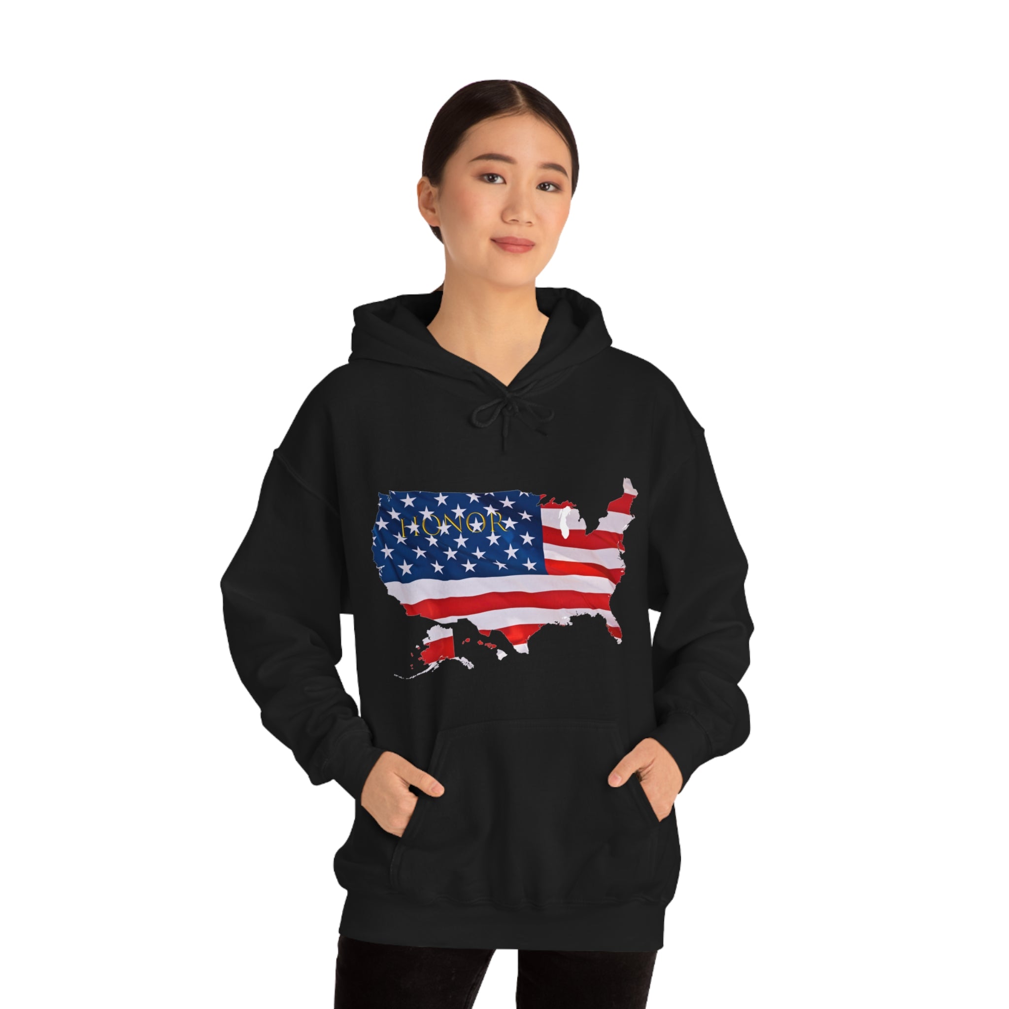 Adult female wearing black hoodie with "Honor USA" inspired American as a Flag graphic on front.